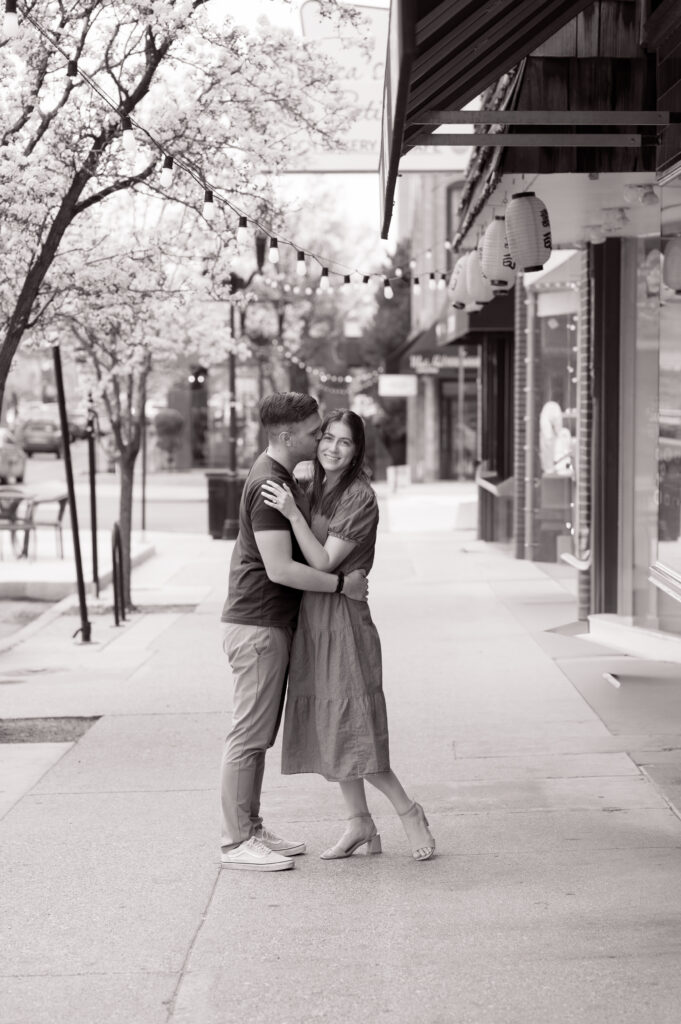 Black-and-white image of a couple on a city street for Salt Lake City Family Photos
