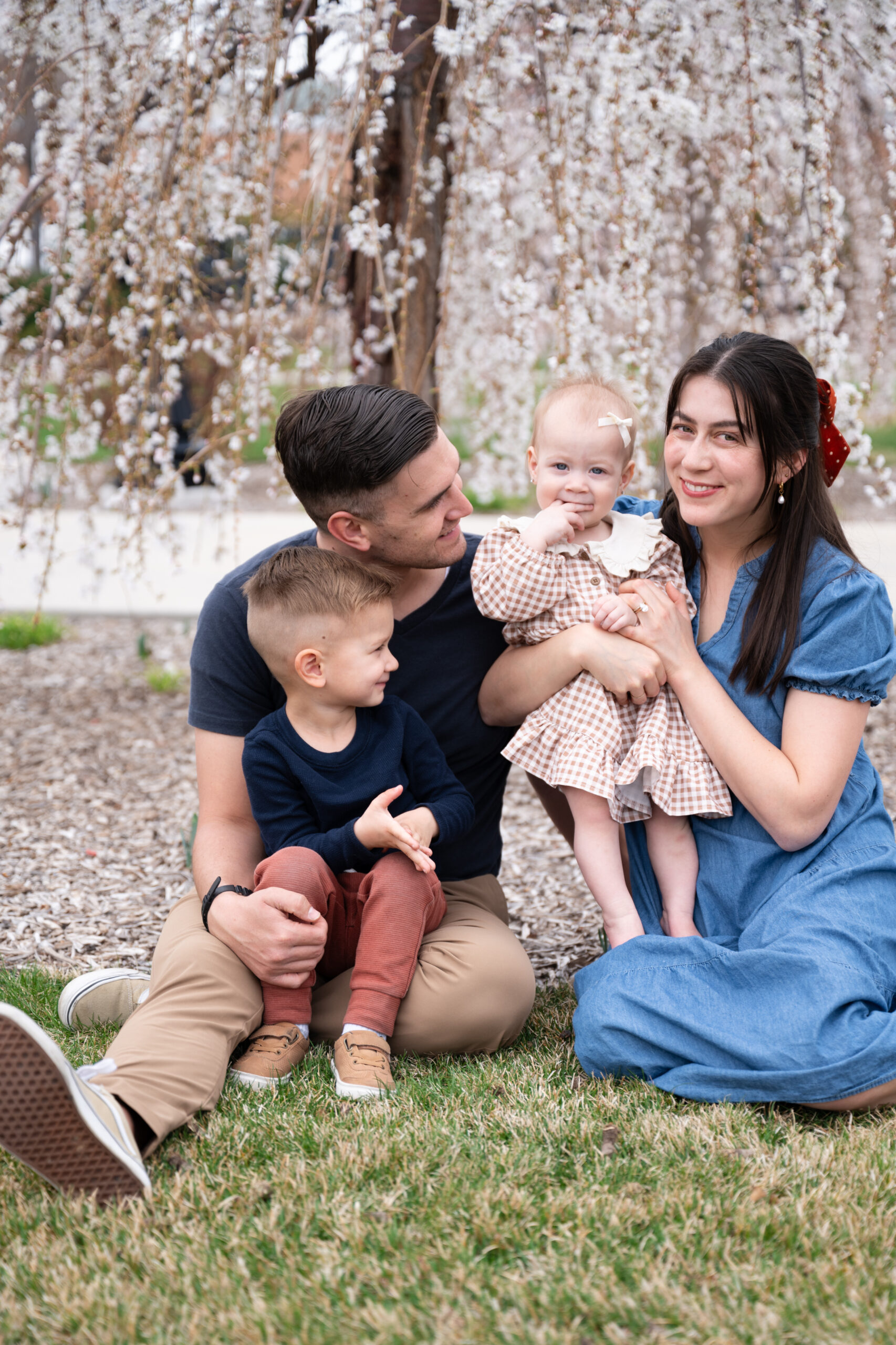 Family wearing coordinating colors of shades of blue and red for Salt Lake City Family Photos