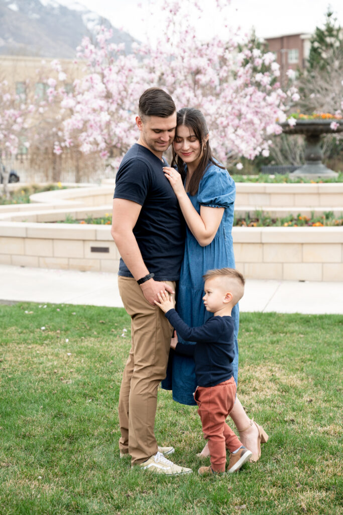 Family of three wearing coordinating outfits for family photos in Salt Lake City, Utah
