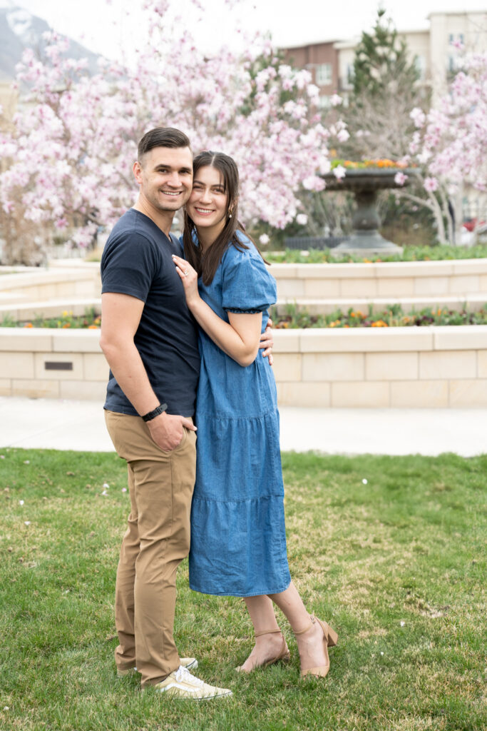 Smiling couple wearing coordinating outfits, posing for Salt Lake City Family Photos
